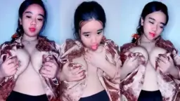 Miss Jijiw Squeezes Her Tits And Licks Her Pussy